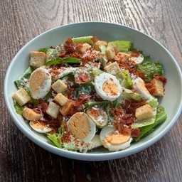 Caesar salad and crispy bacon