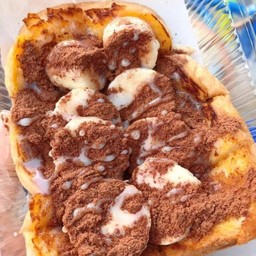 ปังปิ้งกล้วยหอมโรยผงโอตินราดนม