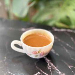 ชาเนสทีนมสดร้อน
