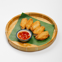 ปีกไก่ทอดนัวนิยม  -  Signature Deep fried chicken wing