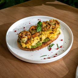 Homemade sourdough with  pesto prawn , scramble and avocado