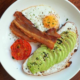 Avocado Toast with sunny side up egg and bacon