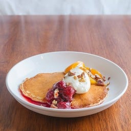 Ricotta Pancakes with fruit compote, mixed nuts and whipped cream