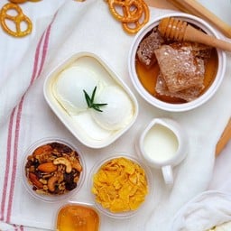 Greek yogurt + honey with granola and conflakes