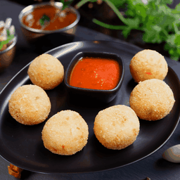 Risotto Cheese Balls with mildly spiced tomato sauce