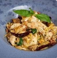 Spicy pasta in garlic olive oil with loads of crab & bacon