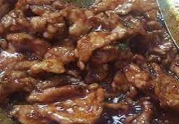 หมูชิ้นน้ำมันหอย ราดข้าว