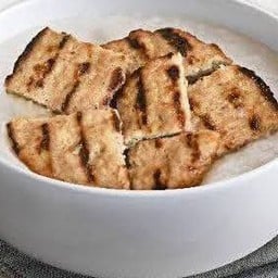 Smoked Grilled Chicken Congee with Spicy Seafood Papaya Salad Sauce โจ๊กไก่รมควันกับซอสส้มตำทะเล