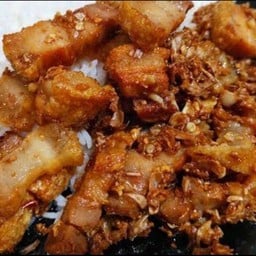 Crispy Pork With Garlic And Pepper On Rice