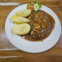 หมูชุปเกล็ดขนมปังทอด ราดซอสเห็ด