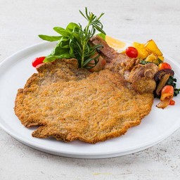 Veal Cutlet Served with Arugola Leaves