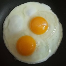 2 Fried Eggs  (Fried together)