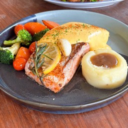Grilled sous vide salmon steak with Hollandaise sauce