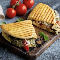 Salmon pesto cheese panini