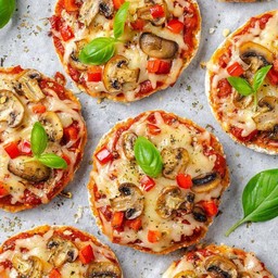 Mushrooms tomatoes bagel pizza