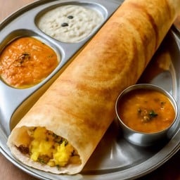 Masala Dosa with potato and curry with coconut sauce