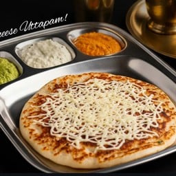 Cheese uttapam served with sambhar