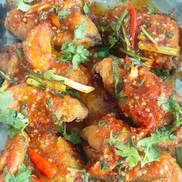 เนื้อปลานิลทอด 2 ชิ้น ราดพริก
