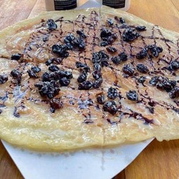 โรตีโบราณ(แผ่นกลม)ราดผงโอวัลติน&ลูกเกด