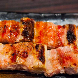 Grilled pork neck rollสันคอหมูเสียบไม้ย่าง