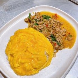 Scrambled egg  over rice with basil spicy Miced pork