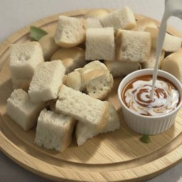 ข.ขนมปัง (ปังนึ่งใส้ทะลัก)