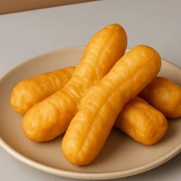 ปาท่องโก๋สะบัดน้ำมันชิ้น