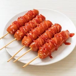 ไส้กรอกยักษ์ทอดเสียบไม้ลูกชายมาโนช