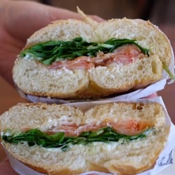 Bagel smoke salmon with rocket salad