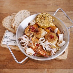 Scallop,prawn,squid in herb butter sauce served with sourdough