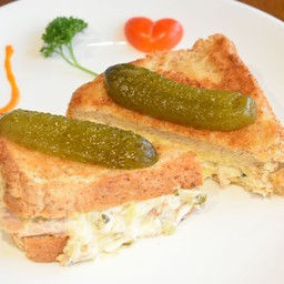 Tuna melt cheddar cheese sandwich on wholewheat toast.