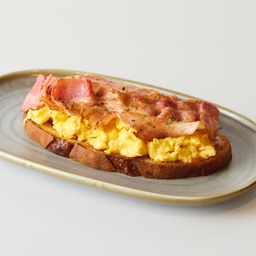 Open sourdough sandwich with scrambled eggs & bacon