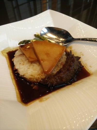 Steamed glutinous rice with conch, superior sea cucumber and preserved meats