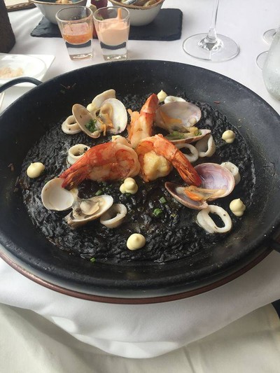 "Arroz negro" black ink paella with tiger prawns and clams