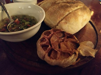 Bread served with Salsa Criolla and Garlic butter