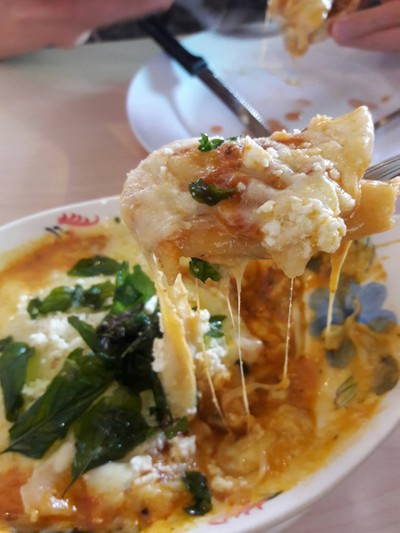 Three-Cheese Lasagna served with garlic bread