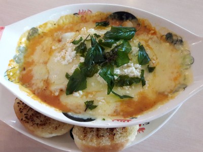 Three-Cheese Lasagna served with garlic bread