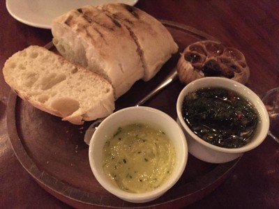 Bread served with Salsa Criolla and Garlic butter