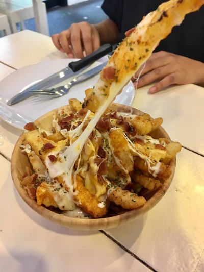 Bacon cheese fries .