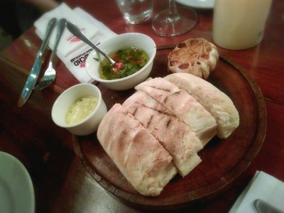 Bread served with Salsa Criolla and Garlic butter
