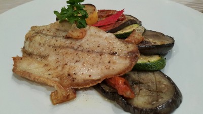 Sea bass lemon sauces served with vegetable