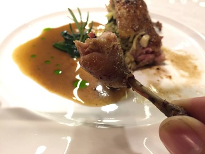 Roasted stuffed French quail with foie gras, wild mushroom, wild rice and quail red wine butter sauce