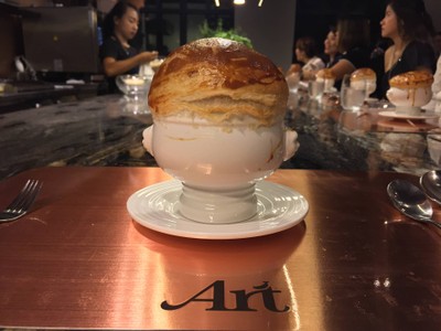 Lobster bisque puff soup with truffle and lobster tail