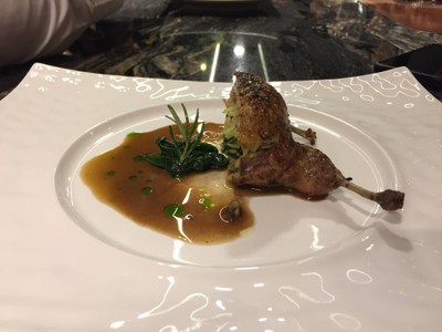 Roasted stuffed French quail with foie gras, wild mushroom, wild rice and quail red wine butter sauce