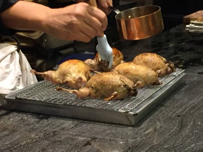 Roasted stuffed French quail with foie gras, wild mushroom, wild rice and quail red wine butter sauce