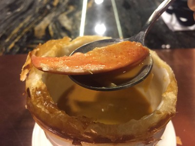 Lobster bisque puff soup with truffle and lobster tail