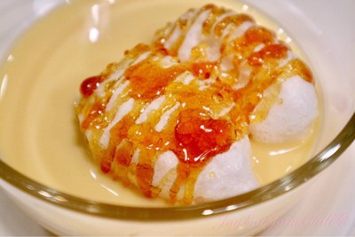 Light Home-made Meringue Floating on Vanilla Sauce