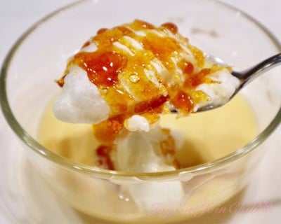 Light Home-made Meringue Floating on Vanilla Sauce