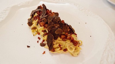 Angel hair black truffle in carbonara sauce
