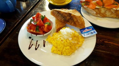 Parmesan scramble eggs with tomato basil and toast